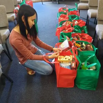 girl packing donations girl packing donations